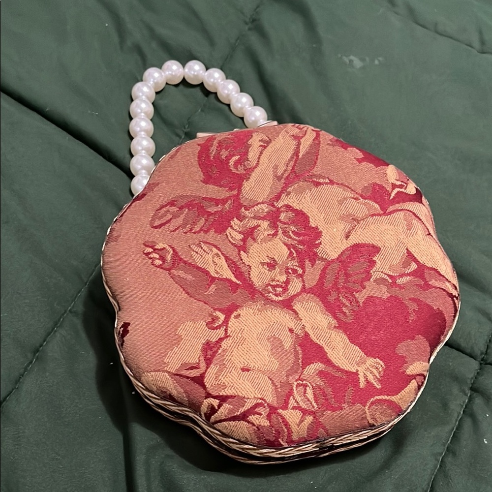 Elegant Cherub Print Clutch with Pearl Handle